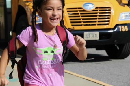 child near a school bus