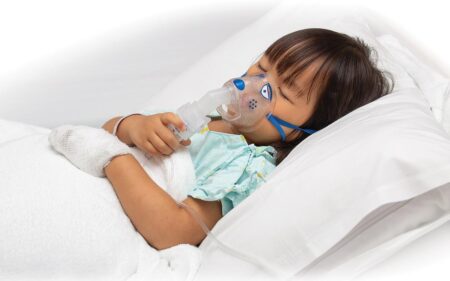 child with oxygen mask