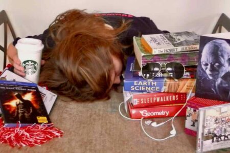 stressed middle school student slumped over table