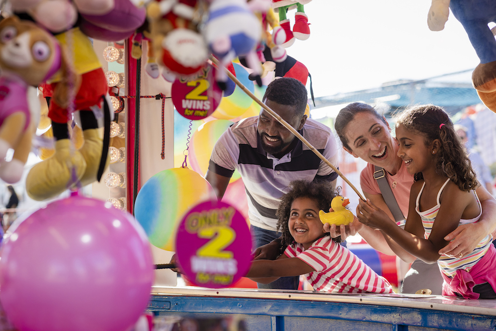 A family enjoying a day out at the fair