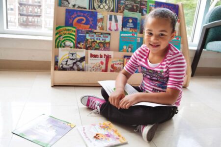 girl in classroom library