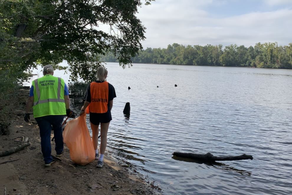 two folks cleaning up the James River