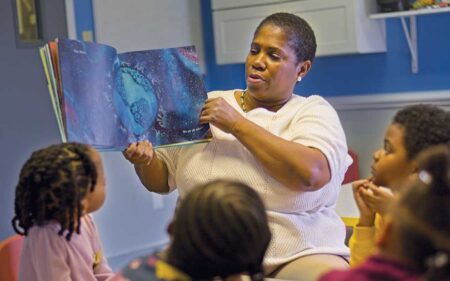 Raquel Evans reading to students