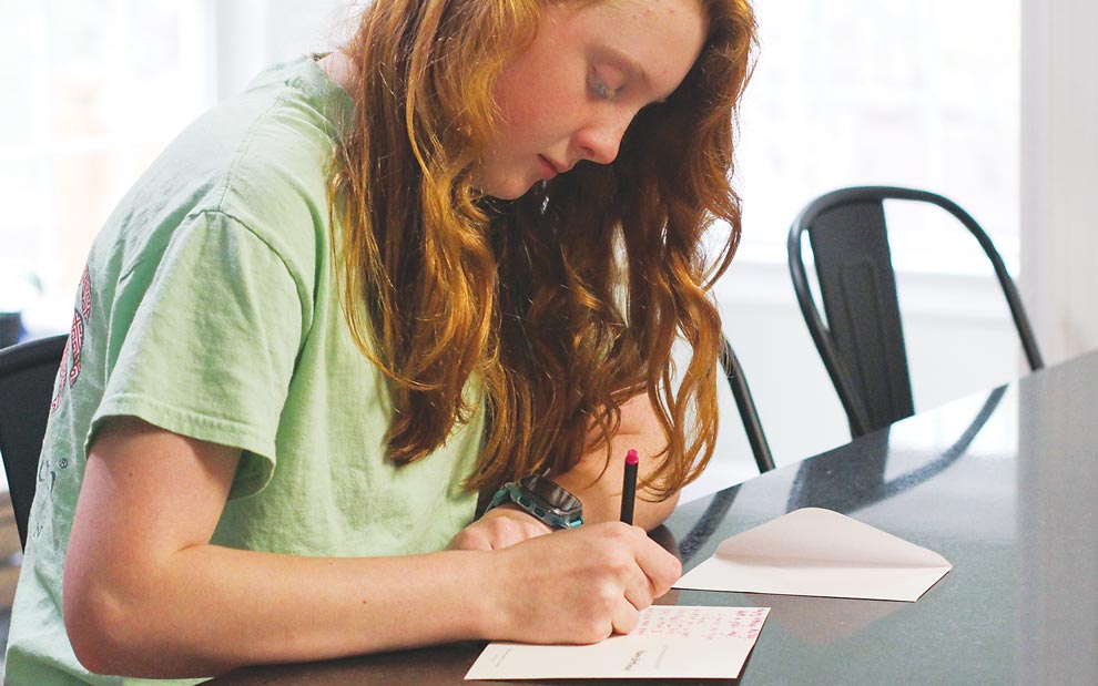 Child writing thank you card