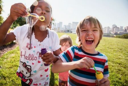 kids playing with bubbles