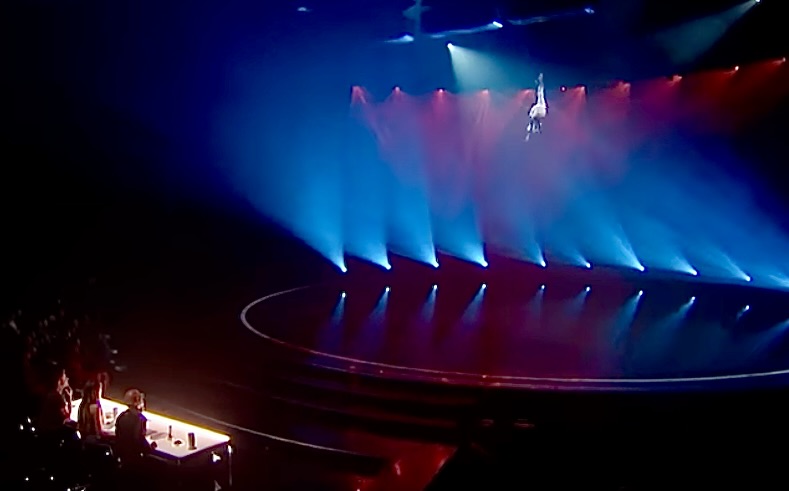 Aidan Bryant dangles on a wire high in a studio on the TV show America’s Got Talent