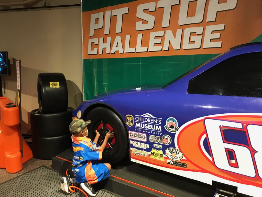 Young boy at hot wheels exhibit