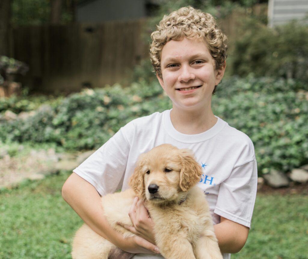 young boy with puppy