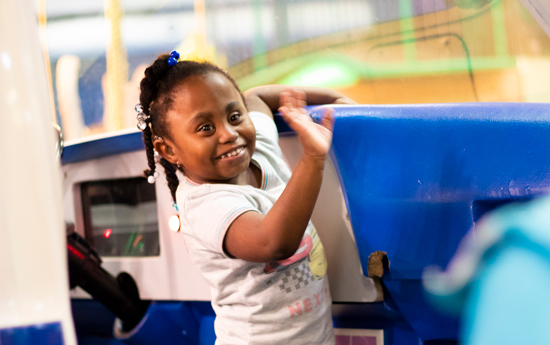 A child with developmental disabilities enjoys play-time at Children's Museum of Richmond