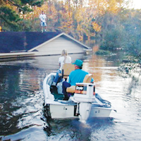 Neighborly rescue efforts underway after a flooding emergency.