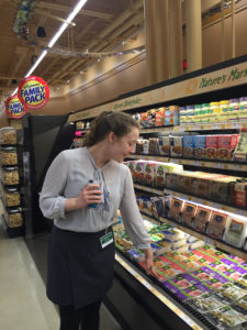 Sam eyes the vast selection of vegan products. 